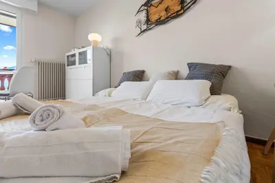 Ein Bett oder Betten in einem Zimmer der Unterkunft Crans-Montana - studio - 2 personnes - balcon avec superbe vue