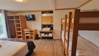 Ein Bett oder Betten in einem Zimmer der Unterkunft Berghotel Hahnenmoos