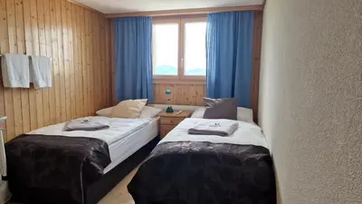 Ein Bett oder Betten in einem Zimmer der Unterkunft Berghotel Hahnenmoos