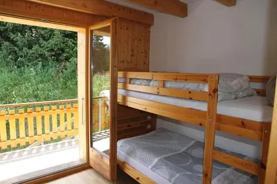 Ein Bett oder Betten in einem Zimmer der Unterkunft Chalet Ski in&out