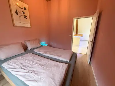 Ein Bett oder Betten in einem Zimmer der Unterkunft LOFT WINTERZEIT - NEAR INTERLAKEN SPIEZ THUN - Wandern und Skifahren