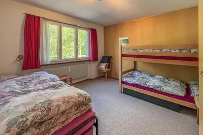 Ein Bett oder Betten in einem Zimmer der Unterkunft Classic Swiss Mountain Panorama