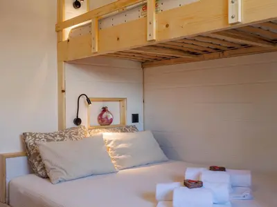 Ein Bett oder Betten in einem Zimmer der Unterkunft Apartment Hortensia 10 by Interhome