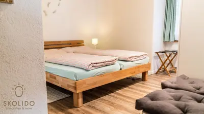 Ein Bett oder Betten in einem Zimmer der Unterkunft Annas Place im Haus zer Briggu Saas-Grund