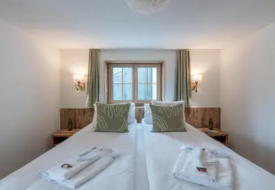 Ein Bett oder Betten in einem Zimmer der Unterkunft Chalet Ledihus Garden Apartment
