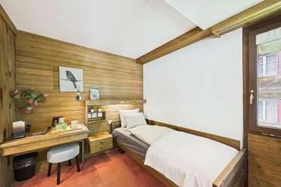 Ein Bett oder Betten in einem Zimmer der Unterkunft Cozy Single Suite in the Heart of Saas-Fee