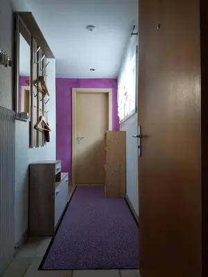 Ein Bett oder Betten in einem Zimmer der Unterkunft Silberblick Ferienwohnungen - aussergewöhnlich & familienfreundlich
