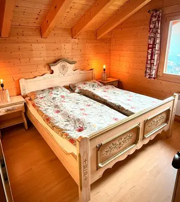 Ein Bett oder Betten in einem Zimmer der Unterkunft Chalet Poiema