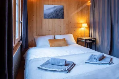 Ein Bett oder Betten in einem Zimmer der Unterkunft Cozy chalet in Kandersteg