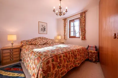 Ein Bett oder Betten in einem Zimmer der Unterkunft Duplexwohnung in den Alpen