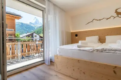 Ein Bett oder Betten in einem Zimmer der Unterkunft Exclusives Studio bei der Bergbahn by Inspiringplaces Zermatt