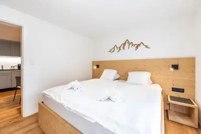Ein Bett oder Betten in einem Zimmer der Unterkunft Modernes und schickes Apartment bei der Bergbahn by Inspiringplaces Zermatt