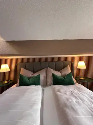 Ein Bett oder Betten in einem Zimmer der Unterkunft CapoBnB Seepanorama am See 10 Min nach Interlaken