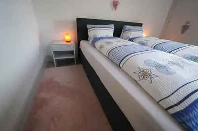 Ein Bett oder Betten in einem Zimmer der Unterkunft Hotel Du Lac - Self Check-in