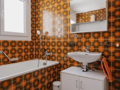 Ein Badezimmer in der Unterkunft Apartment Casa Yolanda 2- OG Süd by Interhome