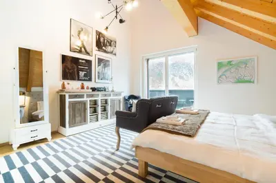 Ein Bett oder Betten in einem Zimmer der Unterkunft Swiss Family Chalet