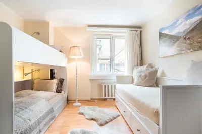 Ein Bett oder Betten in einem Zimmer der Unterkunft Alpenheim Apartment