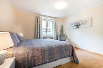 Ein Bett oder Betten in einem Zimmer der Unterkunft Alpenheim Apartment