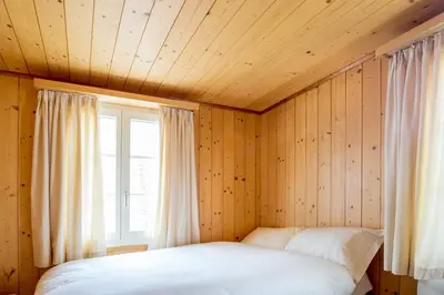 Ein Bett oder Betten in einem Zimmer der Unterkunft HOSPENTAL Chalet