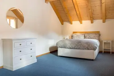Ein Bett oder Betten in einem Zimmer der Unterkunft HOSPENTAL Chalet