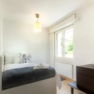 Ein Bett oder Betten in einem Zimmer der Unterkunft AnDerBlick Apartment