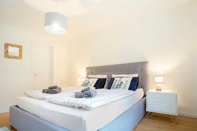 Ein Bett oder Betten in einem Zimmer der Unterkunft Oberalp Apartment