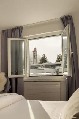 Ein Bett oder Betten in einem Zimmer der Unterkunft Chalet Azzurro