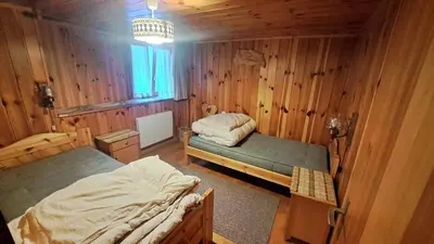 Ein Bett oder Betten in einem Zimmer der Unterkunft FREE Bus Winter Haus Ramona