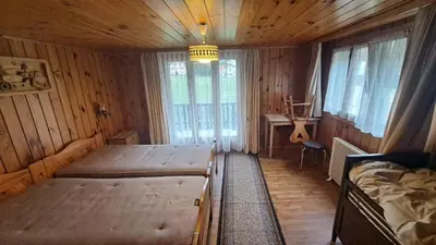 Ein Bett oder Betten in einem Zimmer der Unterkunft FREE Bus Winter Haus Ramona
