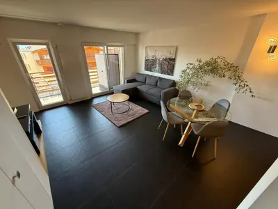 Ein Sitzbereich in der Unterkunft Charmant appartement au centre de Montana