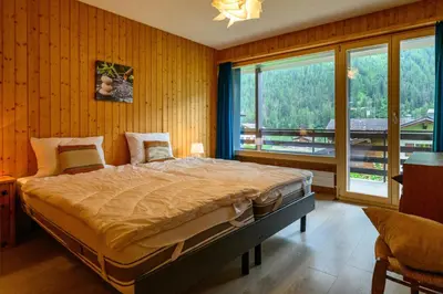 Ein Bett oder Betten in einem Zimmer der Unterkunft Résidence Dent-Blanche, Evolène