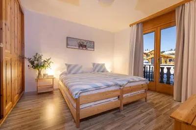 Ein Bett oder Betten in einem Zimmer der Unterkunft Crans-Montana - FABULOUS 2-bedroomed flat