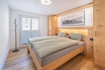 Ein Bett oder Betten in einem Zimmer der Unterkunft Apartment Bergliebe -neu & modern Inspiring places Zermatt