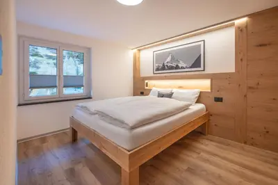 Ein Bett oder Betten in einem Zimmer der Unterkunft Edelweiss Apartment by Inspiringplaces Zermatt