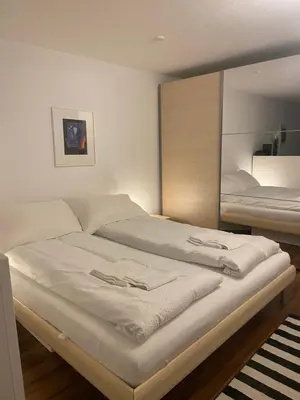 Ein Bett oder Betten in einem Zimmer der Unterkunft Appartement cosy proche ski et bains thermaux