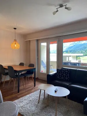 Ein Sitzbereich in der Unterkunft Appartement cosy proche ski et bains thermaux