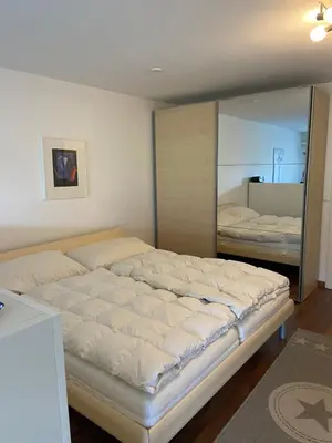 Ein Bett oder Betten in einem Zimmer der Unterkunft Appartement cosy proche ski et bains thermaux