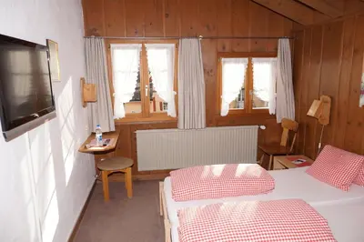 Ein Bett oder Betten in einem Zimmer der Unterkunft Gasthaus zum Sternen