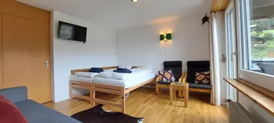 Ein Bett oder Betten in einem Zimmer der Unterkunft Sunny 5 guests apartment by Moosfluh gondola