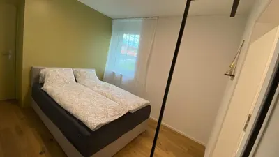 Ein Bett oder Betten in einem Zimmer der Unterkunft FALKE Studio in Spiez