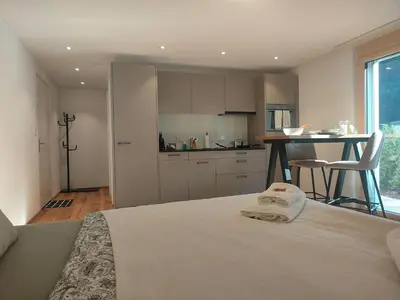 Ein Bett oder Betten in einem Zimmer der Unterkunft Blausee 5min / Interlaken 20min / gratis Parkplatz