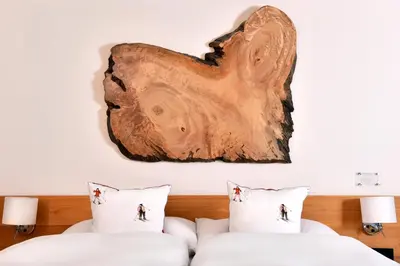 Ein Bett oder Betten in einem Zimmer der Unterkunft The Dom Hotel Saas-Fee operated by Dorint