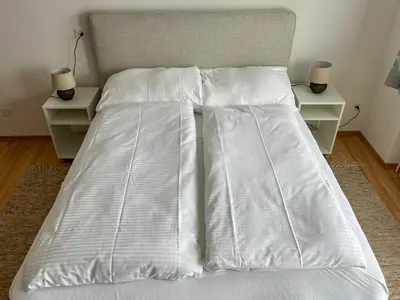 Ein Bett oder Betten in einem Zimmer der Unterkunft Domizil Seeidyll