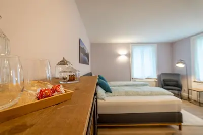 Ein Bett oder Betten in einem Zimmer der Unterkunft B&B Wild und Wandel Meiringen