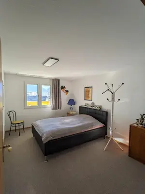 Ein Bett oder Betten in einem Zimmer der Unterkunft Apartment Above the Rooftops - Mountain Panorama