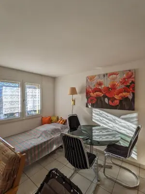 Ein Sitzbereich in der Unterkunft Apartment Above the Rooftops - Mountain Panorama