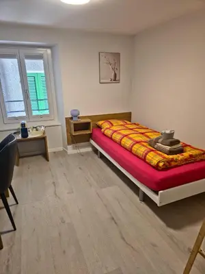 Ein Bett oder Betten in einem Zimmer der Unterkunft Ristorante con stanze Airolo