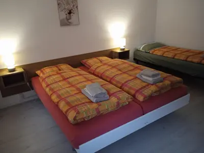 Ein Bett oder Betten in einem Zimmer der Unterkunft Ristorante con stanze Airolo