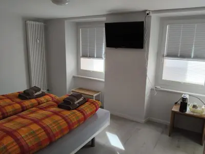 Ein Bett oder Betten in einem Zimmer der Unterkunft Ristorante con stanze Airolo