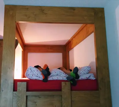Ein Bett oder Betten in einem Zimmer der Unterkunft Swissalpschalet 6 PRO renovated - Same place as Swissalpschalet 4-5